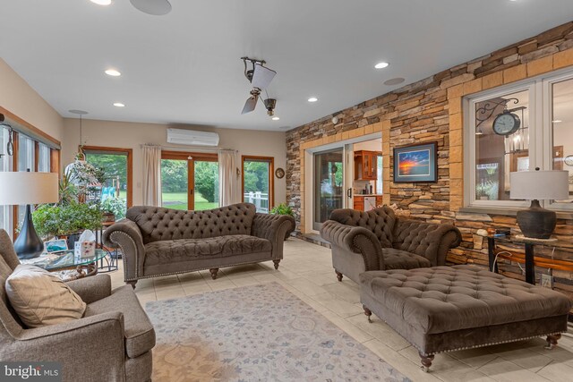 352 Concord Rd, Glen Mills, PA 19342 - living area featuring an AC wall unit, recessed lighting, and light tile patterned flooring