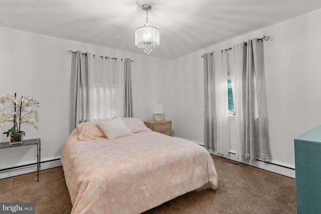 352 Concord Rd, Glen Mills, PA 19342 - carpeted bedroom with baseboard heating and a chandelier