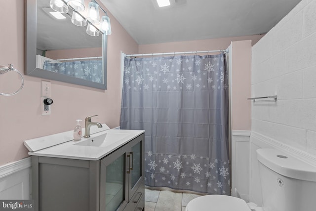 352 Concord Rd, Glen Mills, PA 19342 - bathroom featuring vanity, a wainscoted wall, curtained shower, and tile patterned flooring