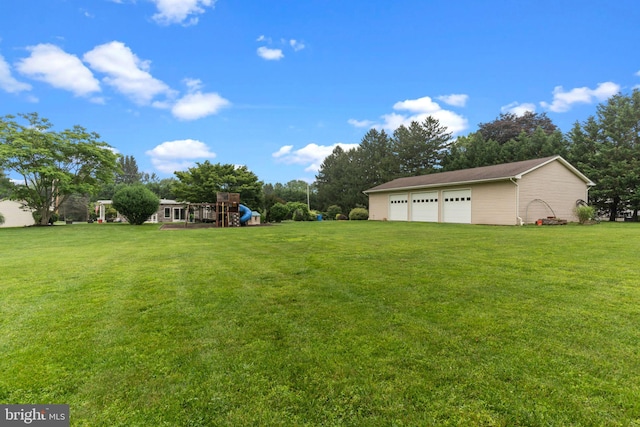 352 Concord Rd, Glen Mills, PA 19342 - view of green lawn with a garage, a playground, and an outbuilding