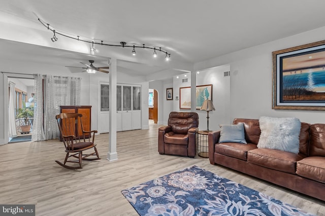 352 Concord Rd, Glen Mills, PA 19342 - living area with light wood-style flooring, arched walkways, and a ceiling fan