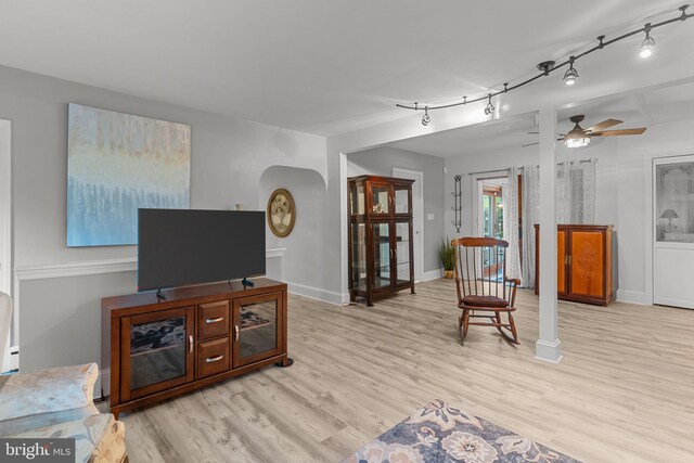 352 Concord Rd, Glen Mills, PA 19342 - living room with light wood-style flooring, arched walkways, a ceiling fan, and track lighting