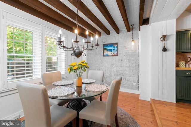 67 W Ferry St, New Hope, PA 18938 - dining space with light wood finished floors, a chandelier, and beamed ceiling