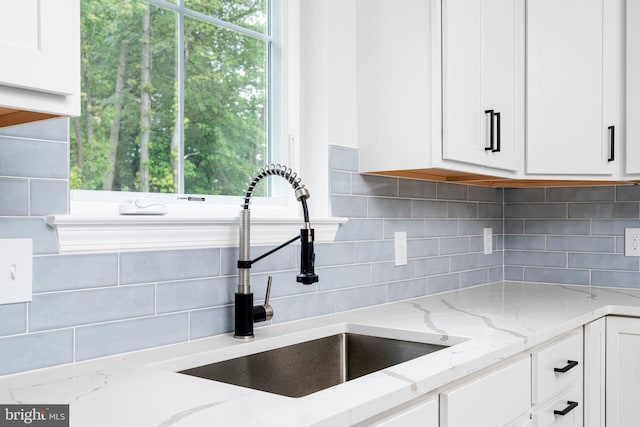 4913 S Broad St, Hamilton, NJ 08620 - kitchen featuring white cabinets, tasteful backsplash, and light stone counters