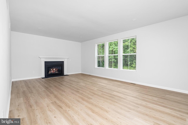 4913 S Broad St, Hamilton, NJ 08620 - unfurnished living room featuring wood finished floors and a glass covered fireplace