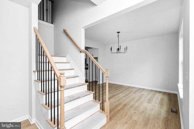 4913 S Broad St, Hamilton, NJ 08620 - stairway with a chandelier and wood finished floors