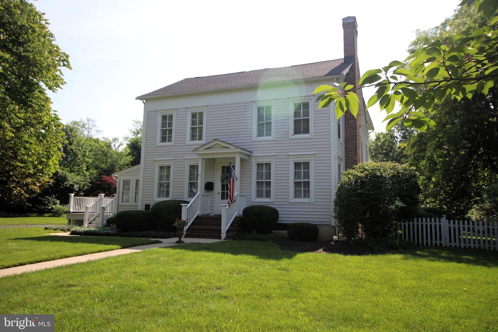 59 S Main St, Cranbury, NJ 08512 - view of front of home with a chimney and a wooden deck