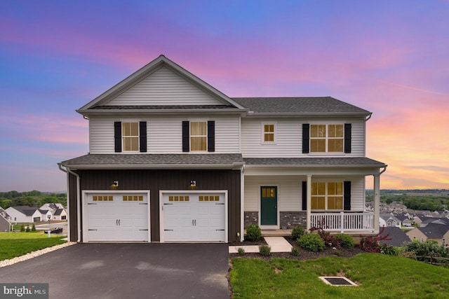 309 Pierson Rd, Lititz, PA 17543 - view of front of property featuring a porch, asphalt driveway, a garage, and a yard
