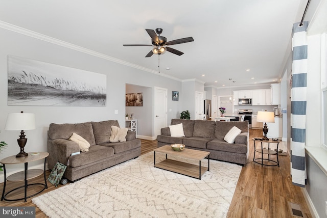 309 Pierson Rd, Lititz, PA 17543 - living room with a ceiling fan, ornamental molding, wood finished floors, and recessed lighting