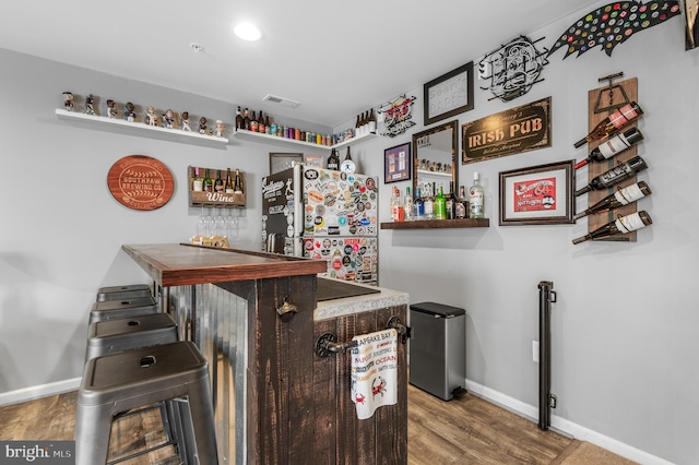 932 Dawes Ct, Bel Air, MD 21014 - indoor wet bar featuring freestanding refrigerator and wood finished floors