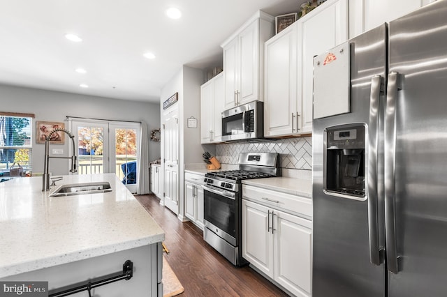 932 Dawes Ct, Bel Air, MD 21014 - kitchen featuring appliances with stainless steel finishes, recessed lighting, light stone countertops, tasteful backsplash, and white cabinetry