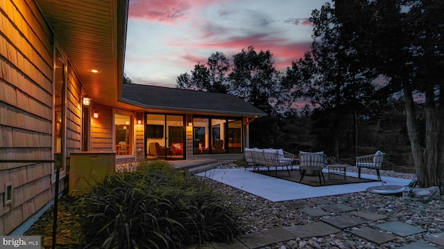 302 Fox Run Rd, Wardensville, WV 26851 - rear view of house featuring a patio, outdoor lounge area, and roof with shingles