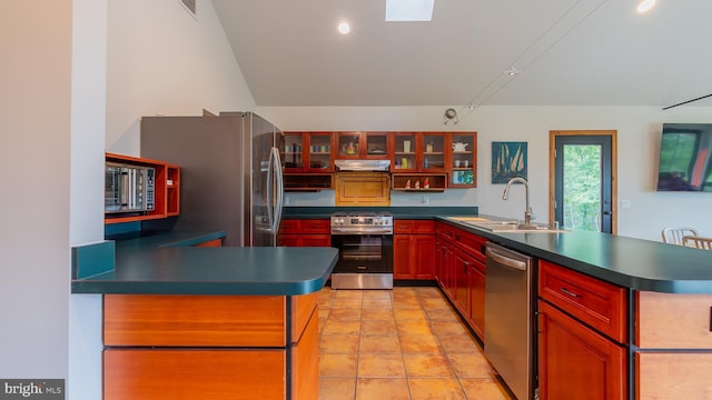 302 Fox Run Rd, Wardensville, WV 26851 - kitchen with stainless steel appliances, a peninsula, dark countertops, reddish brown cabinets, and glass insert cabinets