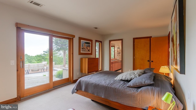 302 Fox Run Rd, Wardensville, WV 26851 - bedroom with access to exterior, light colored carpet, and connected bathroom