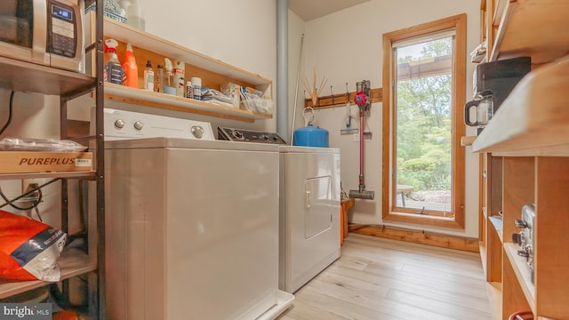 302 Fox Run Rd, Wardensville, WV 26851 - laundry room featuring washing machine and dryer and light wood-style floors