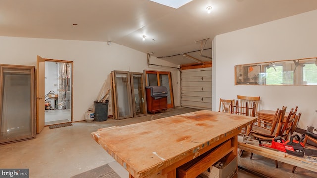 302 Fox Run Rd, Wardensville, WV 26851 - dining area with concrete flooring and vaulted ceiling