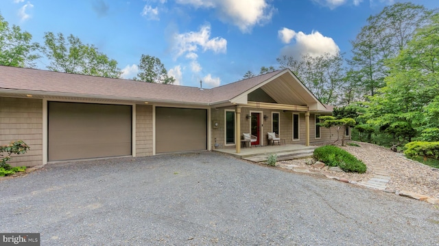 302 Fox Run Rd, Wardensville, WV 26851 - ranch-style house featuring driveway, a porch, a garage, and a shingled roof