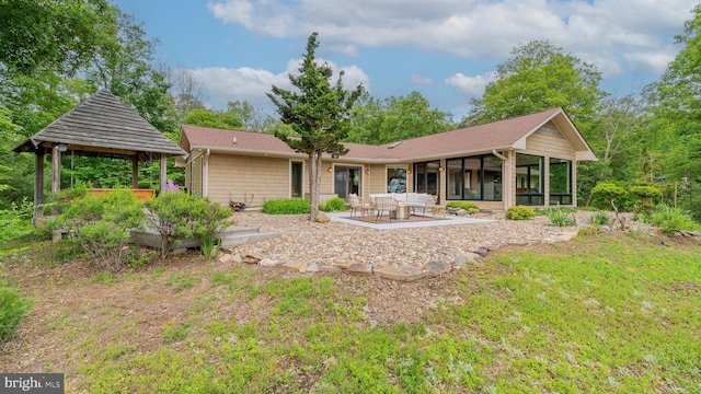 302 Fox Run Rd, Wardensville, WV 26851 - back of property featuring a sunroom, a gazebo, and a patio area