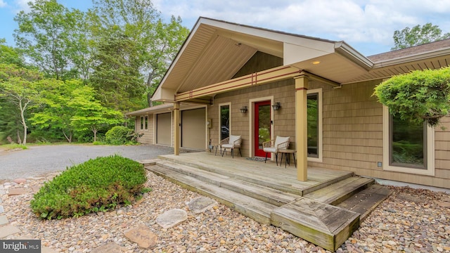 302 Fox Run Rd, Wardensville, WV 26851 - view of front of house with driveway, an attached garage, and a deck