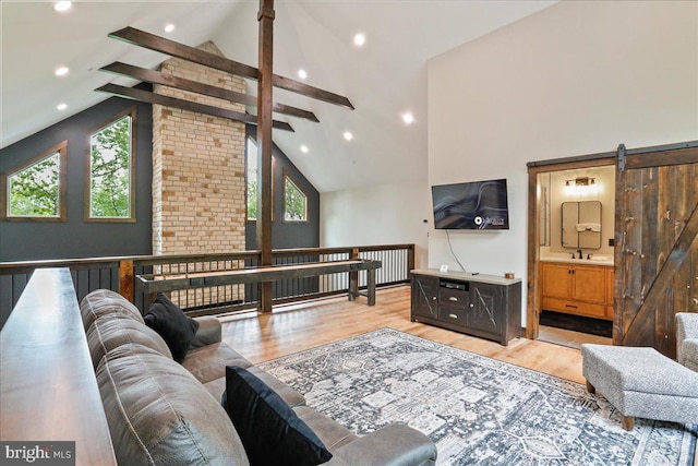 130 Lodestone Way, Mc Henry, MD 21541 - living room with plenty of natural light, light wood finished floors, beam ceiling, recessed lighting, and a barn door