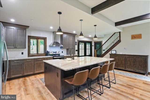 130 Lodestone Way, Mc Henry, MD 21541 - kitchen with wall chimney range hood, stainless steel appliances, light wood finished floors, french doors, and decorative backsplash