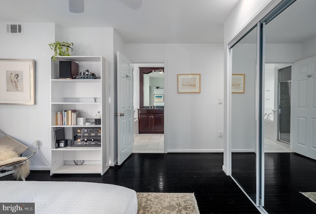 1823 Belmont Rd NW Unit D, Washington, DC 20009 - bedroom with hardwood / wood-style floors, ensuite bathroom, a closet, and a ceiling fan