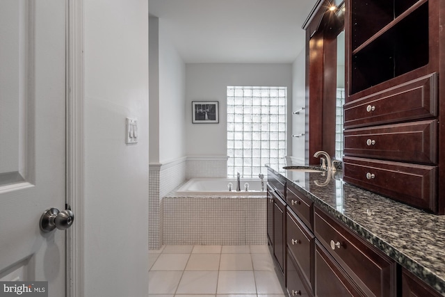 1823 Belmont Rd NW Unit D, Washington, DC 20009 - bathroom featuring vanity, a garden tub, and tile patterned floors