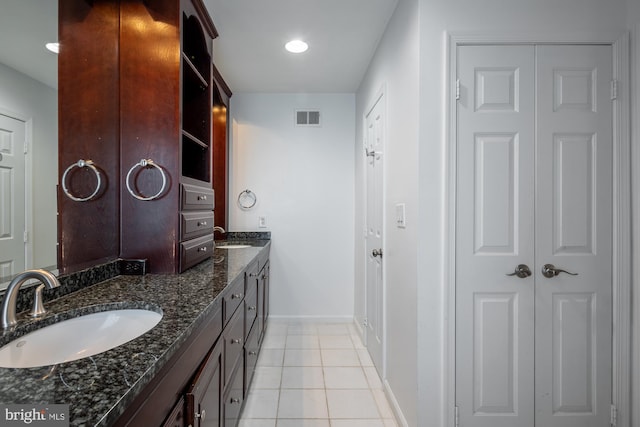 1823 Belmont Rd NW Unit D, Washington, DC 20009 - bathroom with double vanity, tile patterned floors, a closet, and recessed lighting