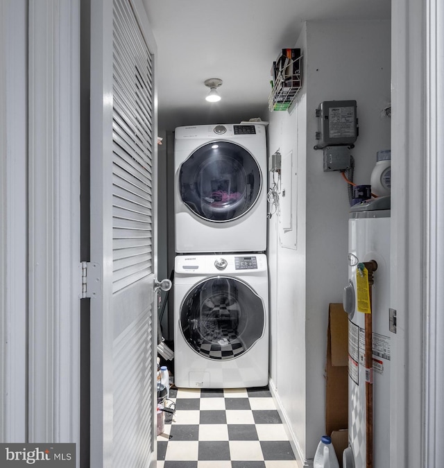 1823 Belmont Rd NW Unit D, Washington, DC 20009 - laundry room with estacked washer and dryer, electric water heater, and tile patterned floors