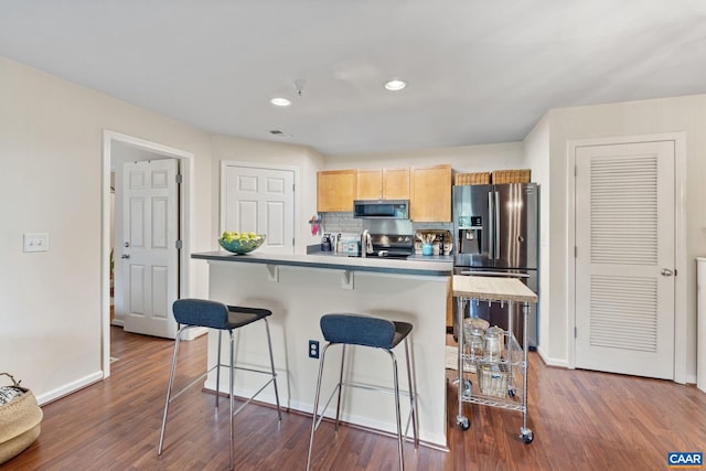 765 Denali Way Unit 204, Charlottesville, VA 22903 - kitchen with stainless steel appliances, dark wood-style flooring, a kitchen breakfast bar, recessed lighting, and backsplash