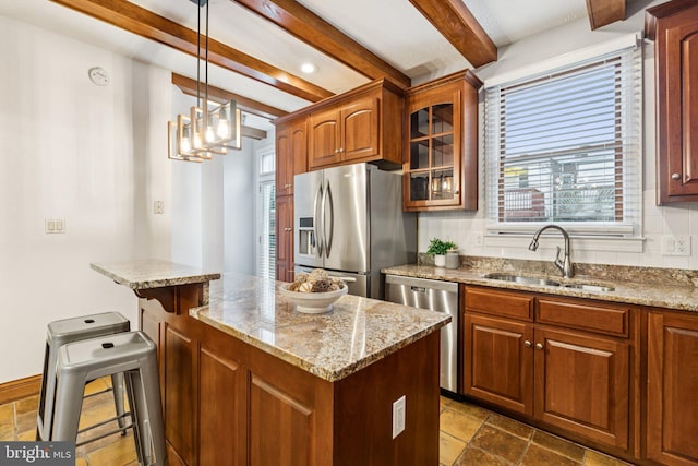 1013 S Decker Ave, Baltimore, MD 21224 - kitchen with appliances with stainless steel finishes, beamed ceiling, stone tile flooring, glass insert cabinets, and light stone counters