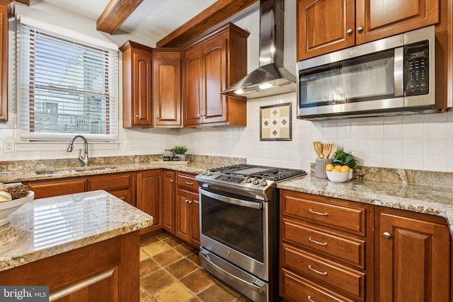 1013 S Decker Ave, Baltimore, MD 21224 - kitchen featuring stainless steel appliances, wall chimney range hood, tasteful backsplash, light stone counters, and beam ceiling