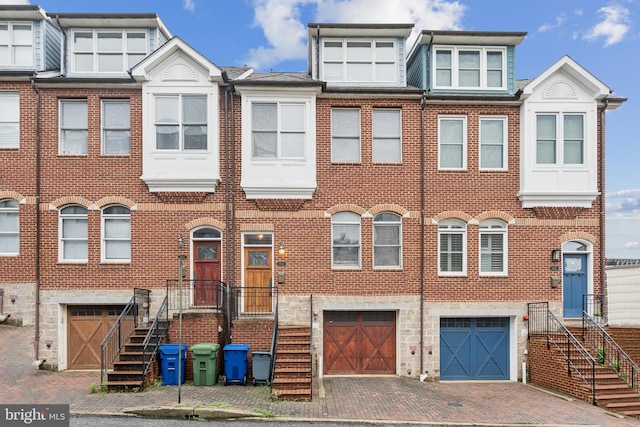 1013 S Decker Ave, Baltimore, MD 21224 - multi unit property with a garage, brick siding, and driveway