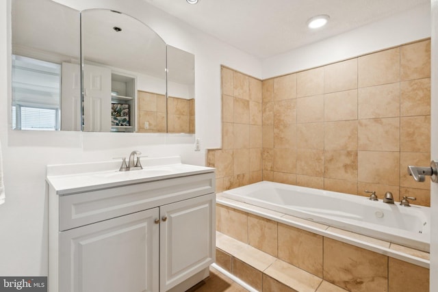 1013 S Decker Ave, Baltimore, MD 21224 - bathroom with a relaxing tiled tub and vanity