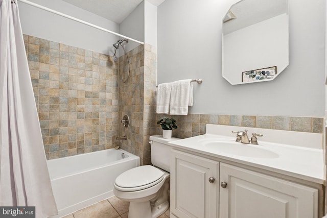 1013 S Decker Ave, Baltimore, MD 21224 - full bath with shower / bath combination with curtain, vanity, tile patterned floors, and tile walls