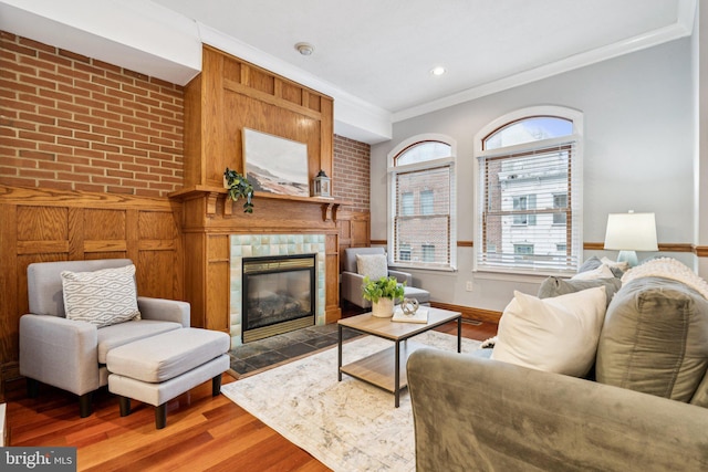 1013 S Decker Ave, Baltimore, MD 21224 - living room with ornamental molding, a fireplace, and wood finished floors