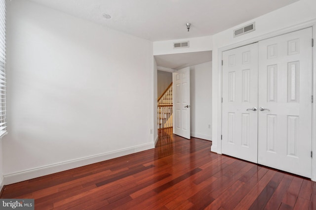 1013 S Decker Ave, Baltimore, MD 21224 - unfurnished bedroom featuring hardwood / wood-style flooring and a closet