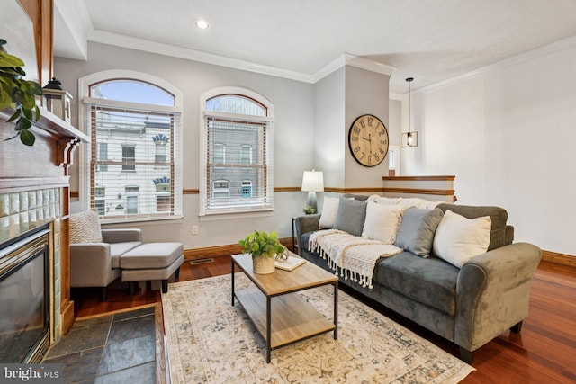 1013 S Decker Ave, Baltimore, MD 21224 - living area with crown molding, plenty of natural light, recessed lighting, a fireplace, and dark wood-style floors