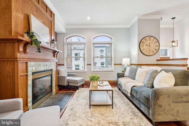 1013 S Decker Ave, Baltimore, MD 21224 - living area with ornamental molding, a fireplace, dark wood finished floors, and recessed lighting