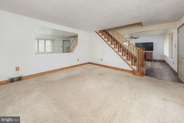 207 E Main St, Penns Grove, NJ 08069 - unfurnished living room featuring stairs, carpet, and ceiling fan