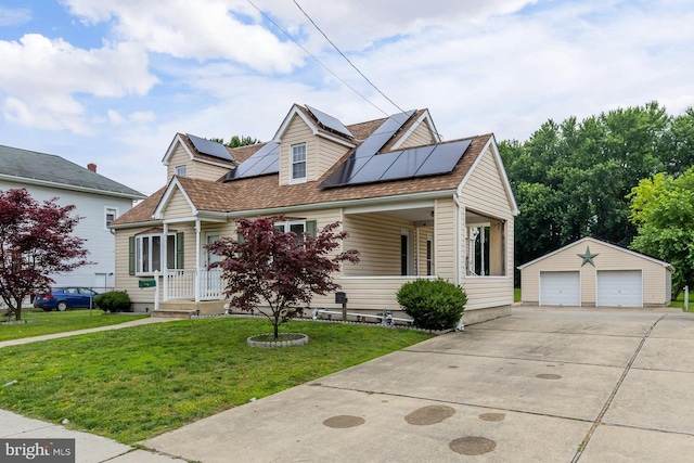 207 E Main St, Penns Grove, NJ 08069 - view of front of property with a detached garage, an outdoor structure, a front yard, and solar panels