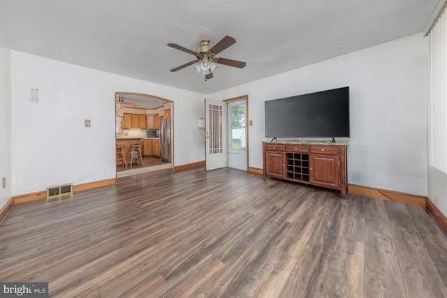 207 E Main St, Penns Grove, NJ 08069 - unfurnished living room featuring dark wood-type flooring, ceiling fan, and arched walkways