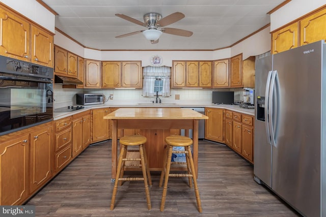 207 E Main St, Penns Grove, NJ 08069 - kitchen featuring black appliances, brown cabinetry, a ceiling fan, and ornamental molding