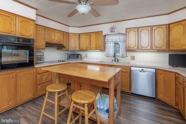 207 E Main St, Penns Grove, NJ 08069 - kitchen featuring black appliances, ceiling fan, backsplash, brown cabinets, and under cabinet range hood