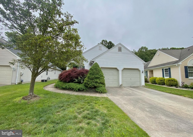 43 Glenview Way E, Gibbsboro, NJ 08026 - view of front of house with an attached garage, concrete driveway, and a front lawn