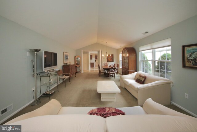 43 Glenview Way E, Gibbsboro, NJ 08026 - carpeted living area with lofted ceiling and a chandelier
