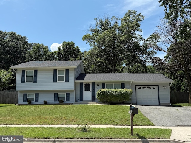 7814 Metacomet Rd, Hanover, MD 21076 - split level home featuring a garage and asphalt driveway