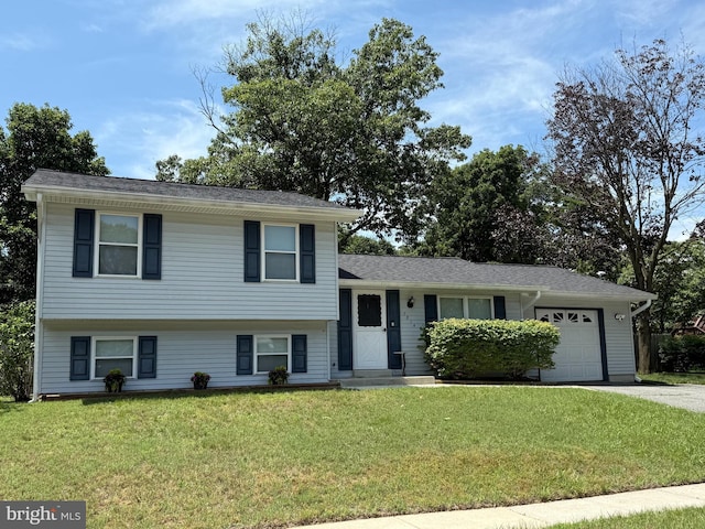 7814 Metacomet Rd, Hanover, MD 21076 - split level home featuring an attached garage, a front yard, and driveway