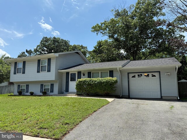 7814 Metacomet Rd, Hanover, MD 21076 - tri-level home featuring an attached garage and asphalt driveway