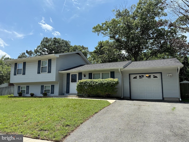 7814 Metacomet Rd, Hanover, MD 21076 - tri-level home featuring an attached garage and asphalt driveway